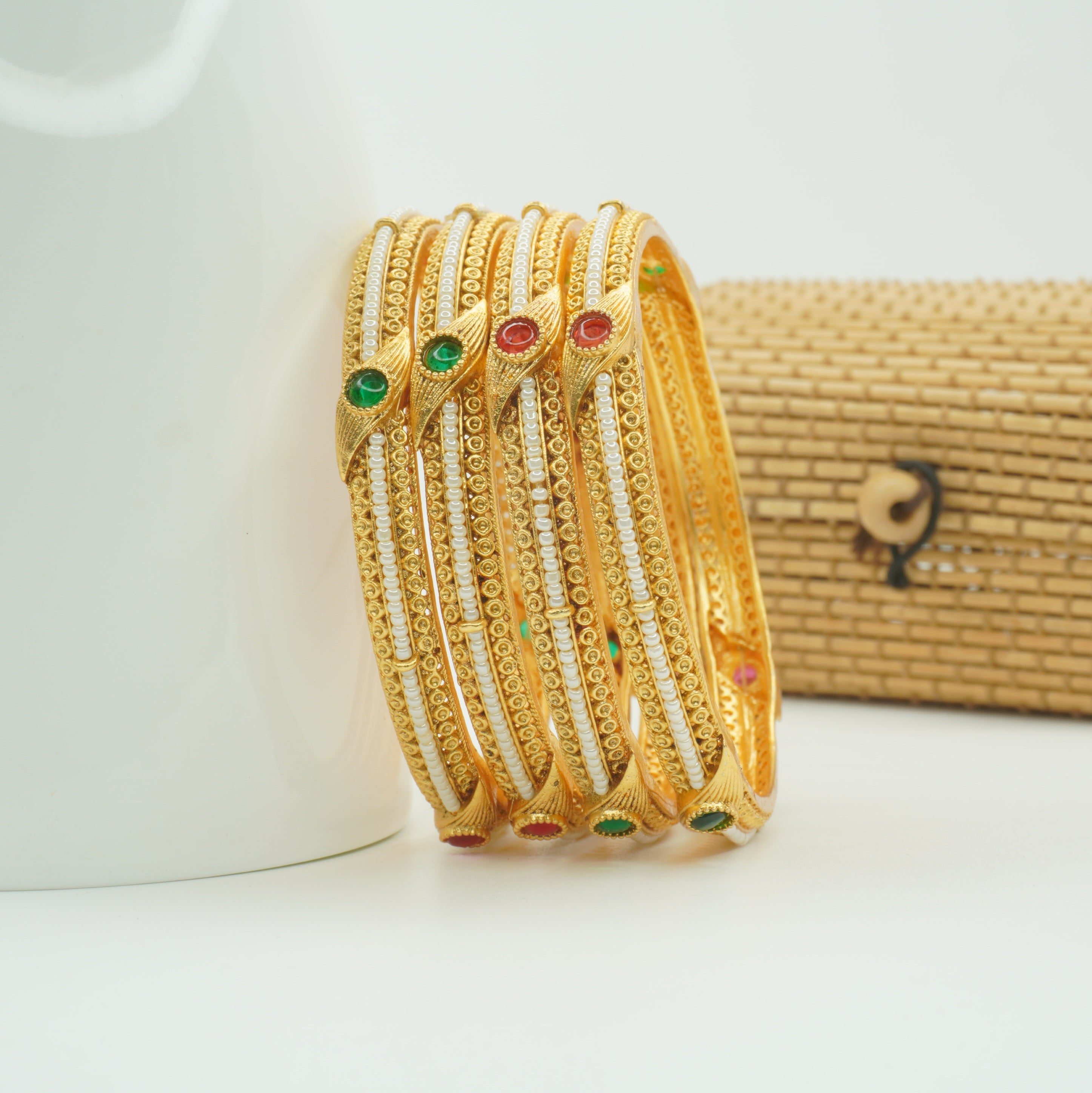 Trending Designer Gold Bangles with Pearl Ruby Emerald Stones for Bridal & Festive Look